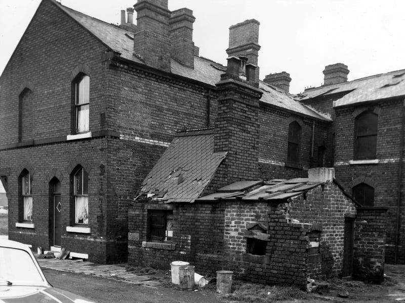 On the far left of the image is the side entrance to number 3 Czar Place. In the centre of the image on Bridge Court is a small run down structure once built to house a shared outside toilet block and midden. On the right can be seen the entrance to Czarina Place.
