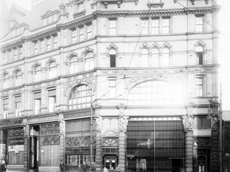 Market buildings showing Kirkgate entrance with Temperance Hotel on left. Other businesses visible are John Bader & Sons, pork and bacon curers and Eastman Ltd, butchers. Pictured in November 1908.