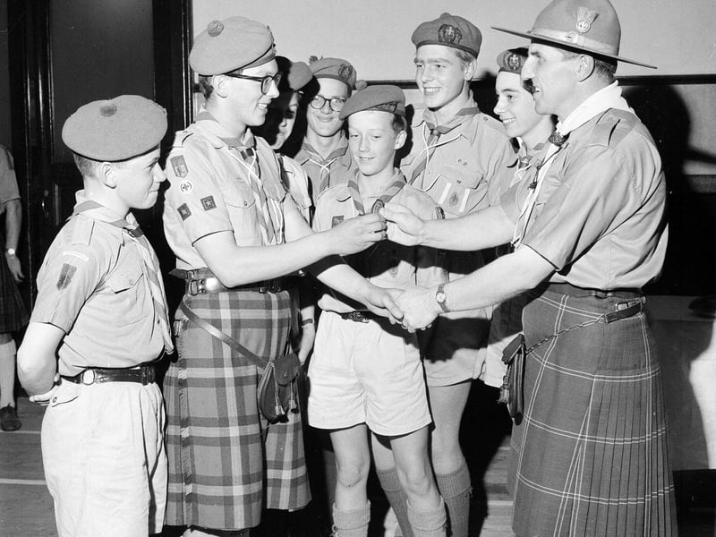 Iain McLean of the 25th Edinburgh Troop being presented with the Queen's Scout Award at Braid Church Hall, in Morningside, in October 1964.