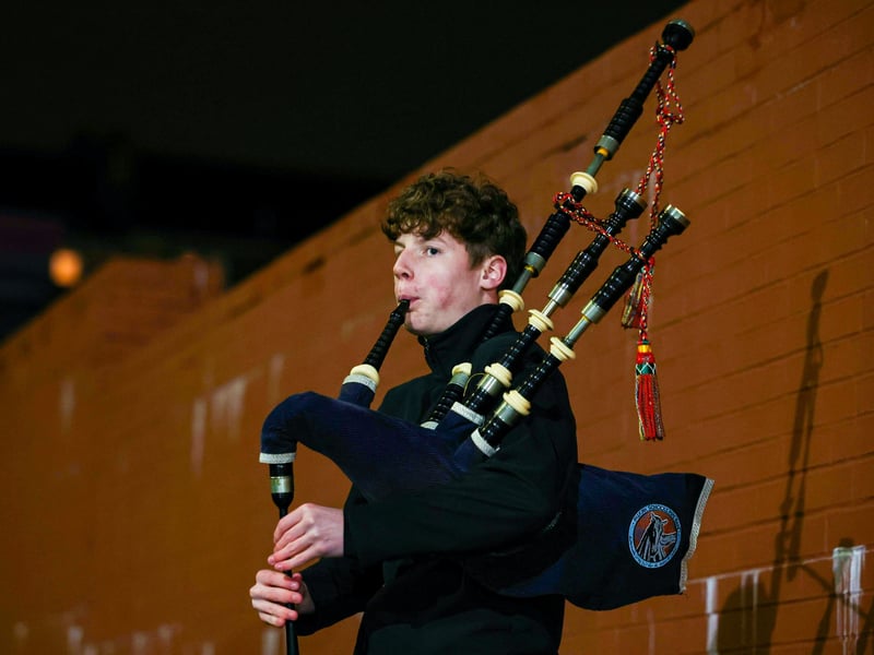 A bagpiper outside of Hampden pre-game.