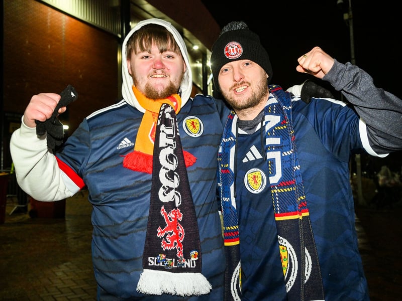 Two fans prepare for kick-off at Hampden.