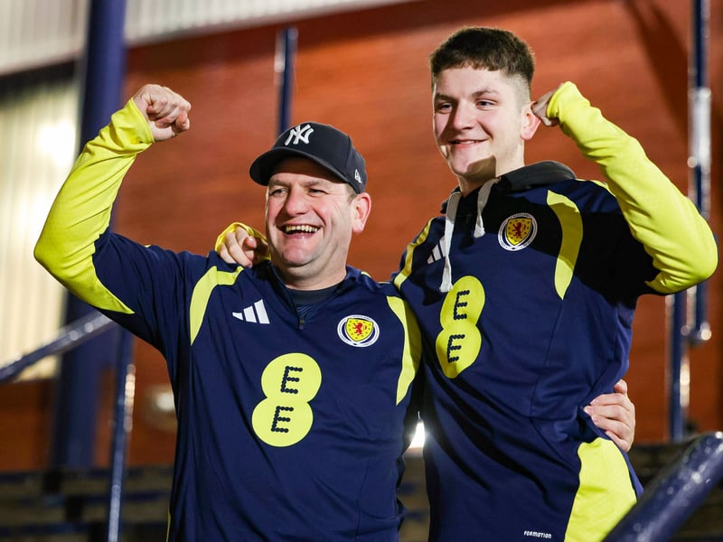 Scotland fans ready for kick-off on the steps at Hampden.