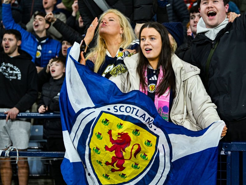 Scotland fans celebrate at full time.