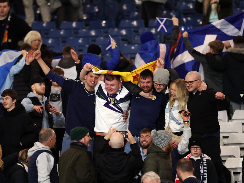 A group of fans soak in the atmosphere.
