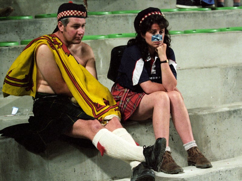 Dejected Scotland fans after the final whistle against Morocco.
