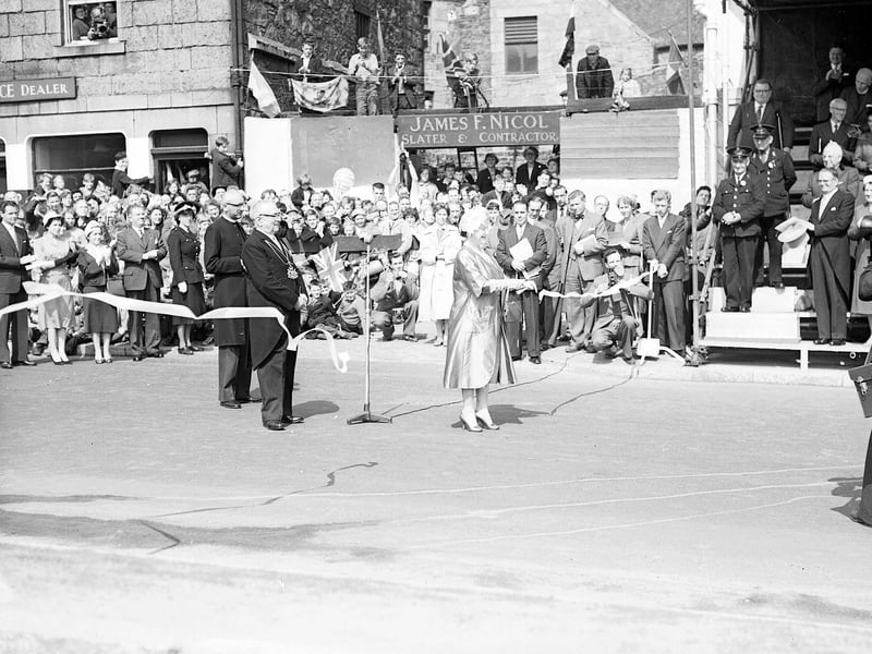 The Queen Mother cutting a tape to open a new boulevard in Aberdeen in May 1959.