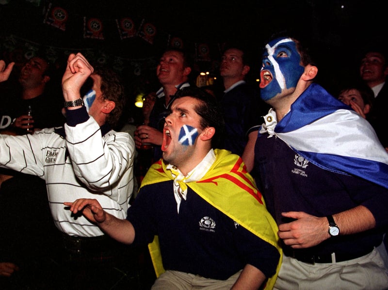 Peter and Derek Kelly, with Bob Slight, watch Scotland take on Morocco in the 98 World Cup, from the Haymarket pub