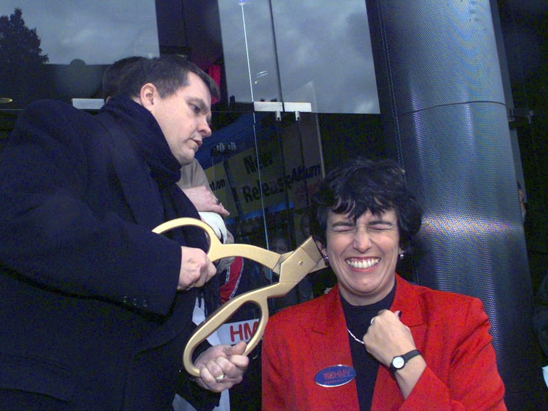 Meatloaf cuts Trisha Saunders' hair during the opening ceremony of the new HMV store on Princes Street, Edinburgh, in 1998