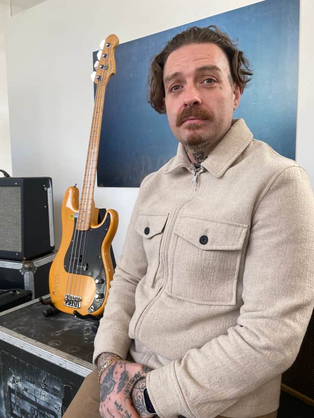 Arctic Monkeys original bassist Andy Nicholson with the bass guitar he used to record classics
