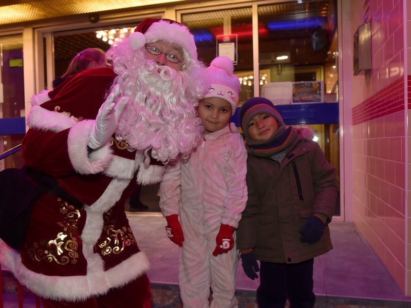 Christmas lights in High Street, Cosham, were switched on during the evening of Friday, November 21, 2025.


Pictured is: (l-r) Father Christmas with Nicole Grace (6) and Ahleion Grey Pontilla (5) from Cosham.

Picture: Sarah Standing (211125-2903)