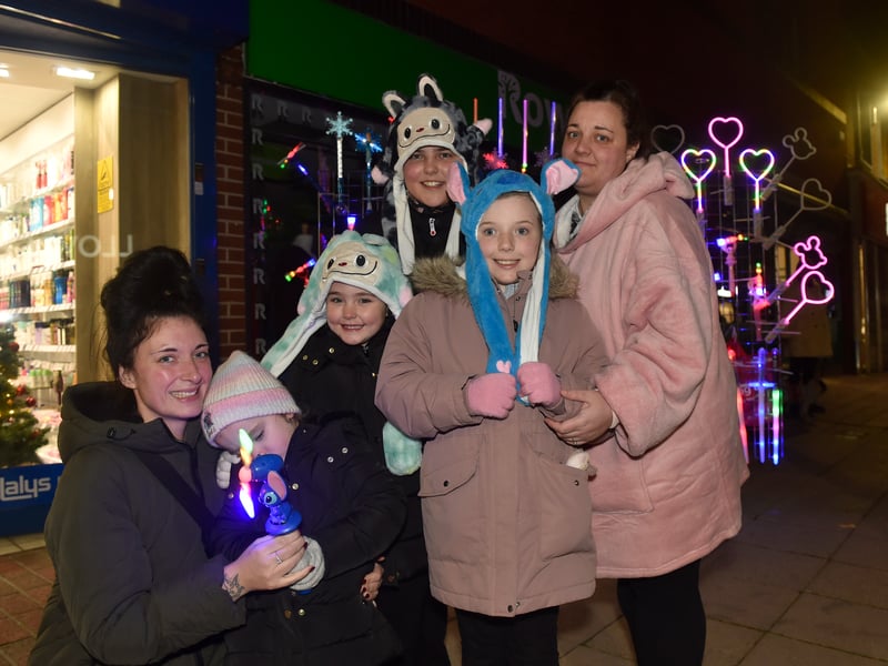 Christmas lights in High Street, Cosham, were switched on during the evening of Friday, November 21, 2025.


Pictured is: (l-r) Abbie Marten from Cosham with Narla Hearn (3), Lola Hearn (5), Kai Burgess (12), Evie-Rose Burgess (8) and Melissa Marten from Waterlooville.

Picture: Sarah Standing (211125-2903)