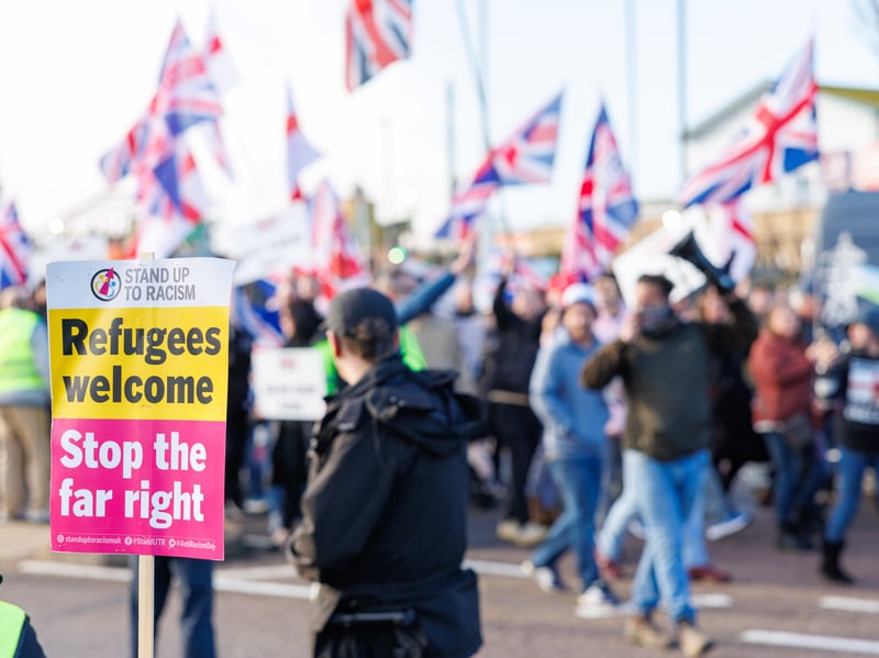 Anti-immigration and anti-racism demonstrators line the streets of ...