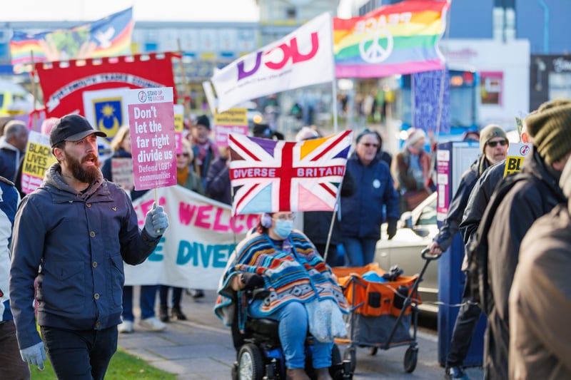 Anti-immigration and anti-racism demonstrators line the streets of ...