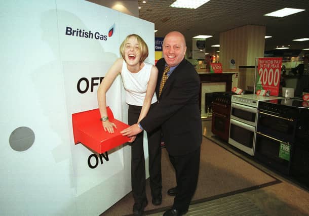 Radio Aire FM presenter Katy Kaboom turns on the electricity market for British Gas at their Eastgate showroom. She is pictured with area manager Paul Waite.