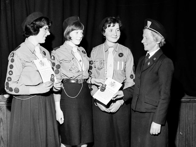 Three members of the 146th Company Girl Guides receive their Queen's Badges in Bruntsfield Church Hall in June 1965.