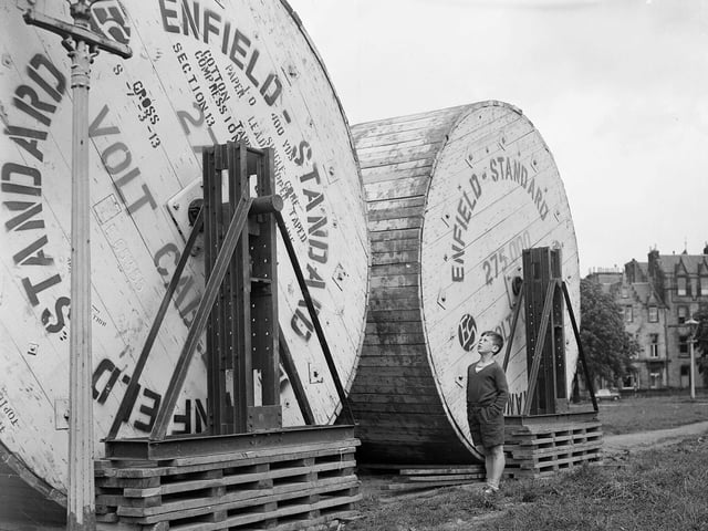Electricity board cable drums on Bruntsfield Links waiting to be laid for sodium lighting in August 1963.