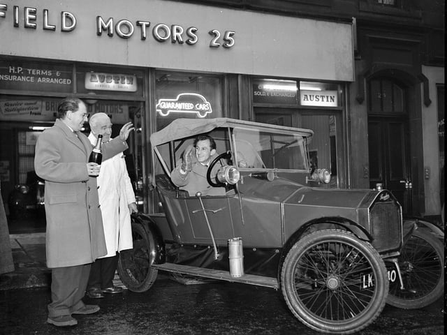 A vintage 1913 Humberette car leaves Bruntsfield Motors garage for the Rootes Motor Museum in London in 1958. 
