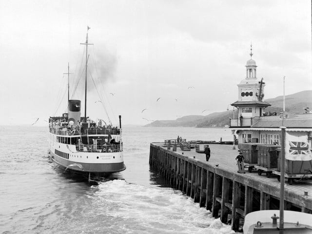 Glasgow holidaymakers on board the Queen Mary II steamer take a trip down the River Clyde in July 1966.