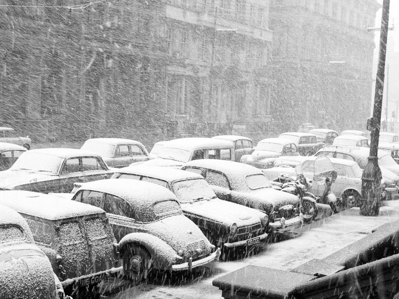 Snow covered cars in St Vincent Street during blizzards in April 1963.