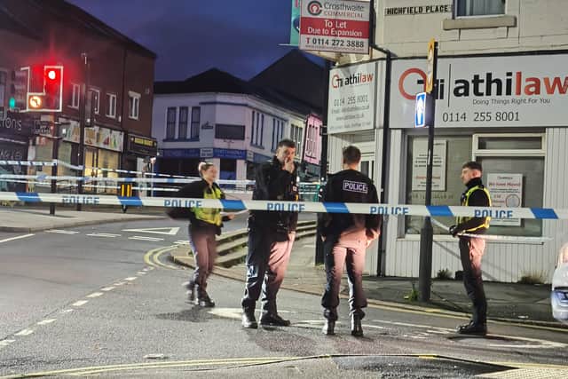 Police on London Road in the aftermath of the shooting