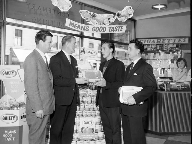 Competition winners receive their prizes at St Cuthberts Co-op Society, in Tollcross, in July 1962.