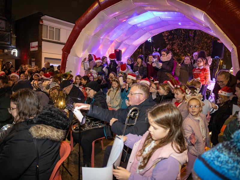Denmead Brass were backed by singers from local schools.