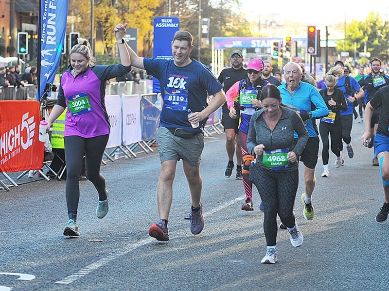 We did it! Runners crossing the line.