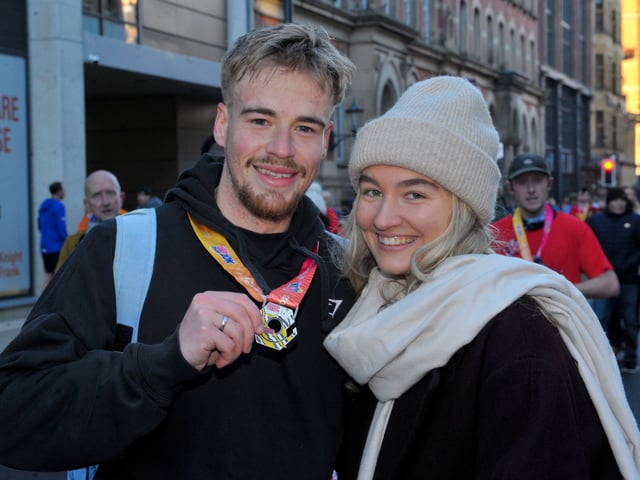 Mac Brindley of Cleckheaton shows his medal to his girlfriend Grace Newton.