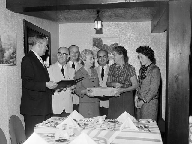 Sam Proudfoot, the retiring manager of Cramond Inn, receives a presentation from Mr L D Gumley in May 1963.