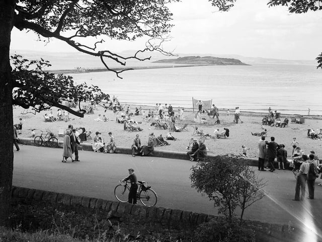 A view of Cramond promenade, beach and Cramond Island in July 1958.