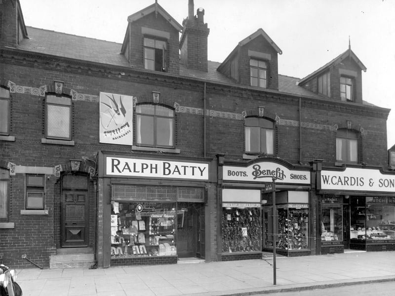 Station Road in August 1939. Number 67 on the left, doorway to house, also number of men's outfitters business of Ralph Batty. Next, on the right number 65 is the Benefit Boot and Shoe company shop. Then number 63, William Cardis and Sons butchers.