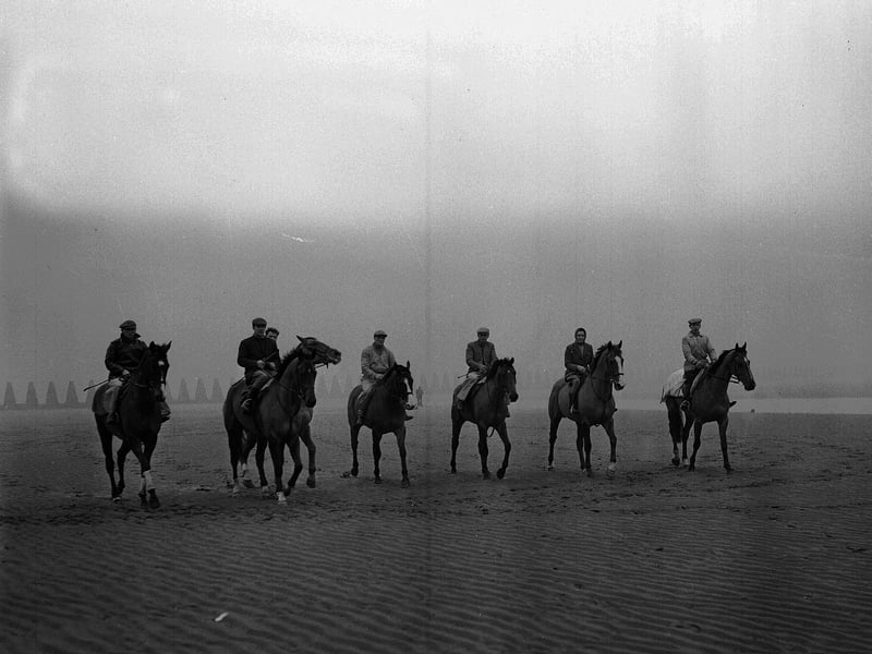 Race horses in training on sands at Cramond in January 1962.