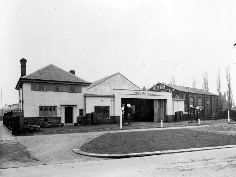 Premier Garage ( proprietor Percy Boddy ) on Avenue Road, now called Cross Gates Road. Charles Linson, Funeral Director can be seen on the right. Pictured in March 1936.