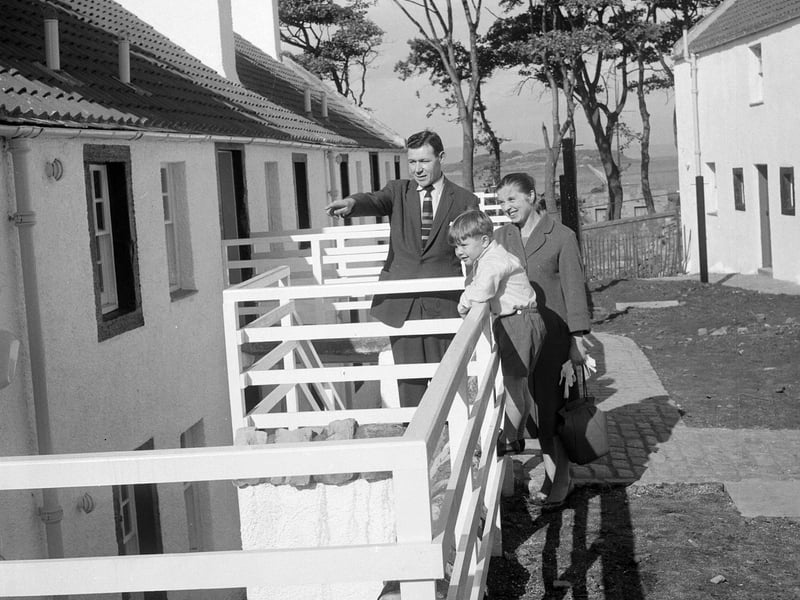 A family inspect some of the features of renovated houses in Cramond offered for sale by Edinburgh Corporation in September 1961.
