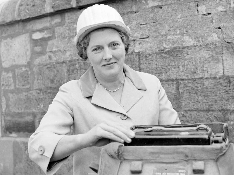 Mrs JA Kirkpatrick presses the button to demolish Cramond Bridge in August 1963.