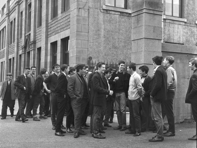 Apprentices stand outside the gates of Bertram & Son Ltd in Leith Walk in June 1966.