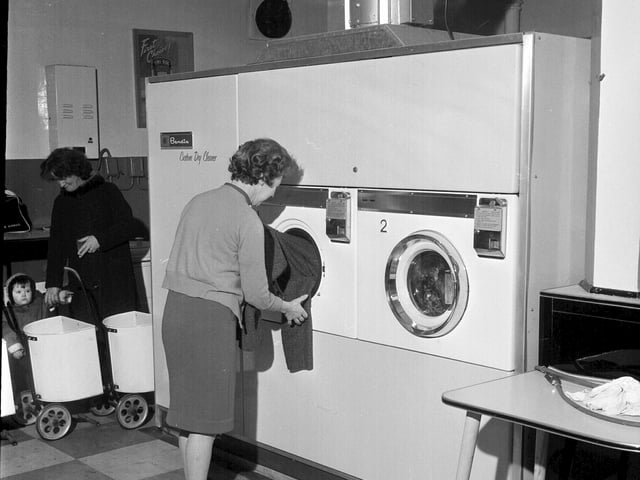 Trying out a coin operated dry leaning machine at a laundrette at 342 Leith Walk in February 1964.