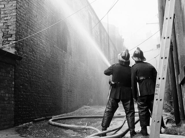 Emergency services tackle a fire at a warehouse in Orchardfield Lane, just off Leith Walk, in July 1965.