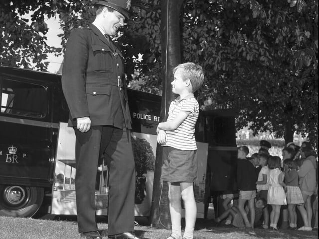 Little Angus McPherson talks to a London Metropolitan Police officer at a police recruitment drive in Princes Street Gardens in July 1966