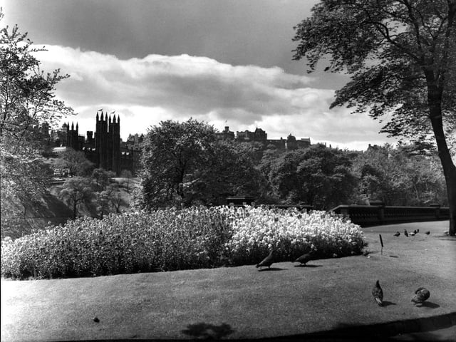 The view from Princes Street Gardens looking towards Edinburgh Castle in the centre and the Assembly Hall on the Mound on the left in July 1962.