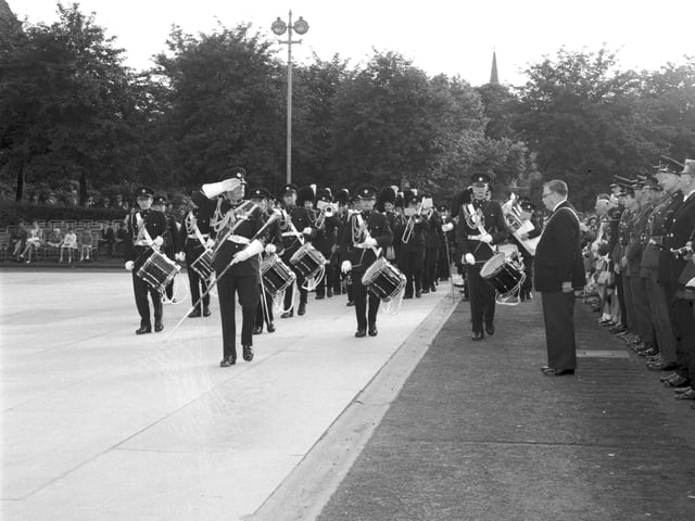 Lord Provost Brechin takes the salute from Drum Major of the pipe band of the 432 Engineers Regiment of the Territorial Army Beating the Retreat in Princes Street Gardens in July 1966.