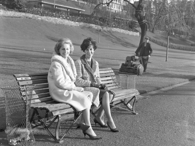Friends Judith Gee and Alice Brown enjoy the spring sunshine on a Princes Street Gardens park bench in March 1966.