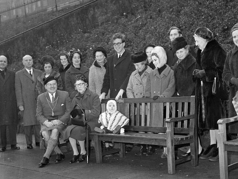 Bailie Hugh McPherson receives a seat in Princes Street Gardens from Mrs Anne R Priestman in December 1964.