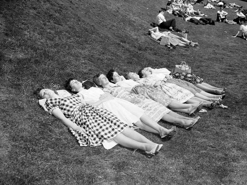 Girls sunbathing in Princes Street Gardens during the heatwave of June 1960.