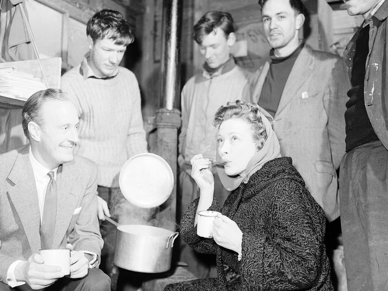 Actors Vanessa Lee and Peter Graves visit Edinburgh University students living in hut in Princes Street Gardens for Refugee Week in February 1960.