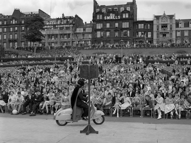 Kenneth Sutherland rides a motor scooter blindfolded in Princes Street Gardens in July 1958.