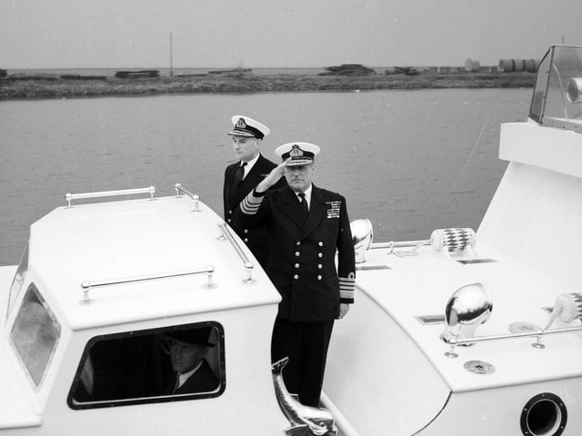 King Olav of Norway takes the salute at HMS Lochinvar, Port Edgar, the Royal Navy's mine warfare training school at South Queensferry as part of his state visit to Scotland in October 1962.