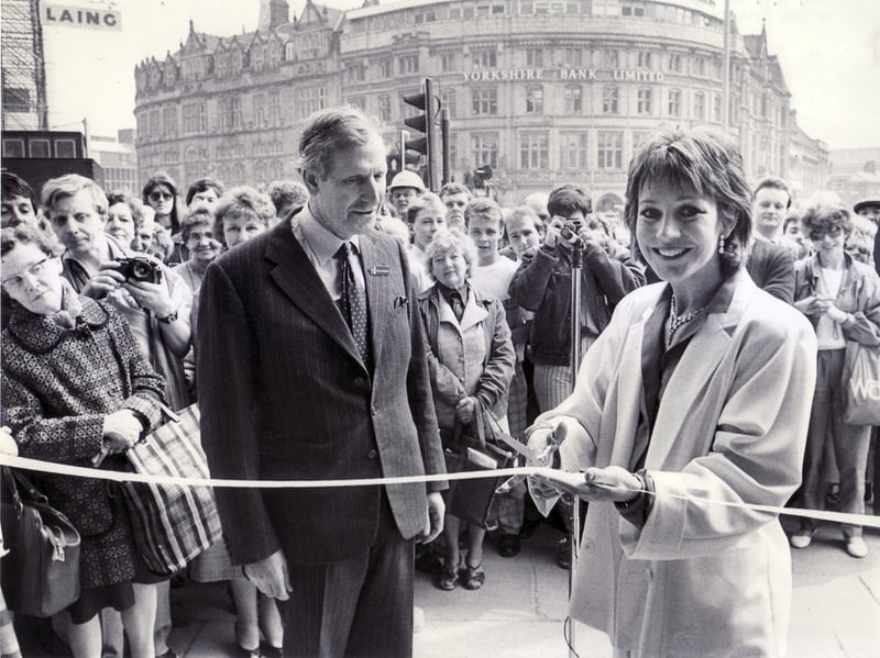TV star Jan Francis cuts the ribbon at the official opening of the new H.L. Brown jewellery shop at Barker's Pool, Sheffield, in May 1986, alongside the business's managing director Michael Frampton, great grandson of the firm's founder