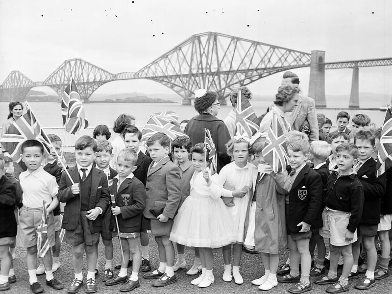 Children with flags wait to join in festivities at the South Queensferry fair in June 1962.