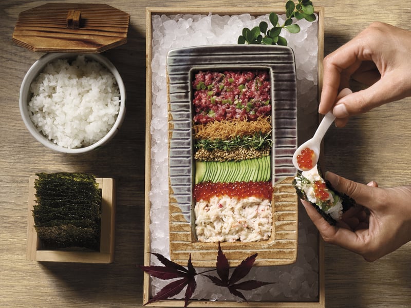 Starters and sides include Scottish soy-cured salmon, wagyu tartare, mushroom croquettes and chicken karaage, while sushi highlights range from classic rolls to caviar-topped nigiri and build-your-own temaki with lobster, wagyu tartare, avocado, sushi rice and crispy nori (pictured).
